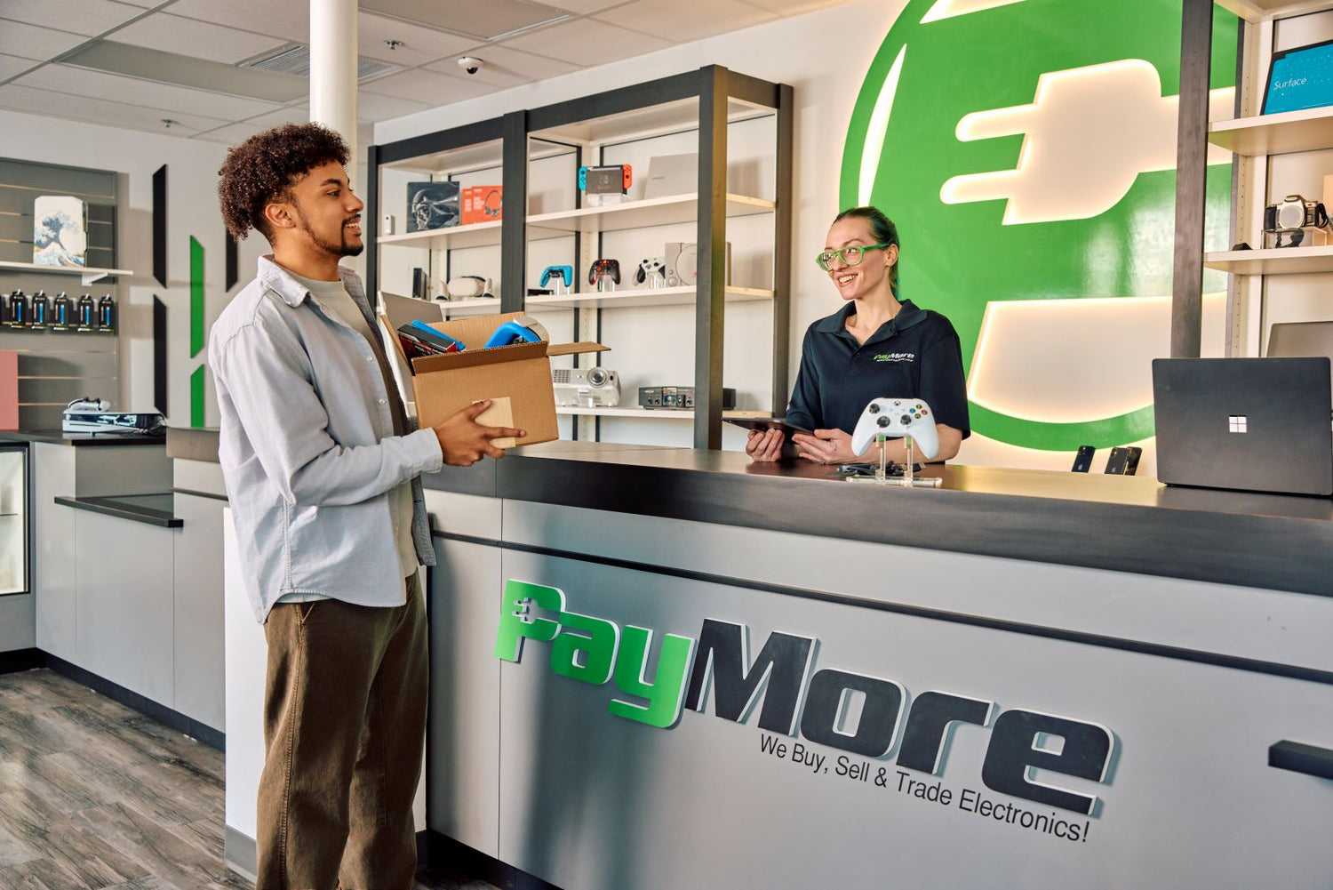paymore employee inspecting electronics